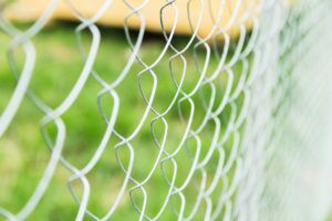 durable construction fence in the country background